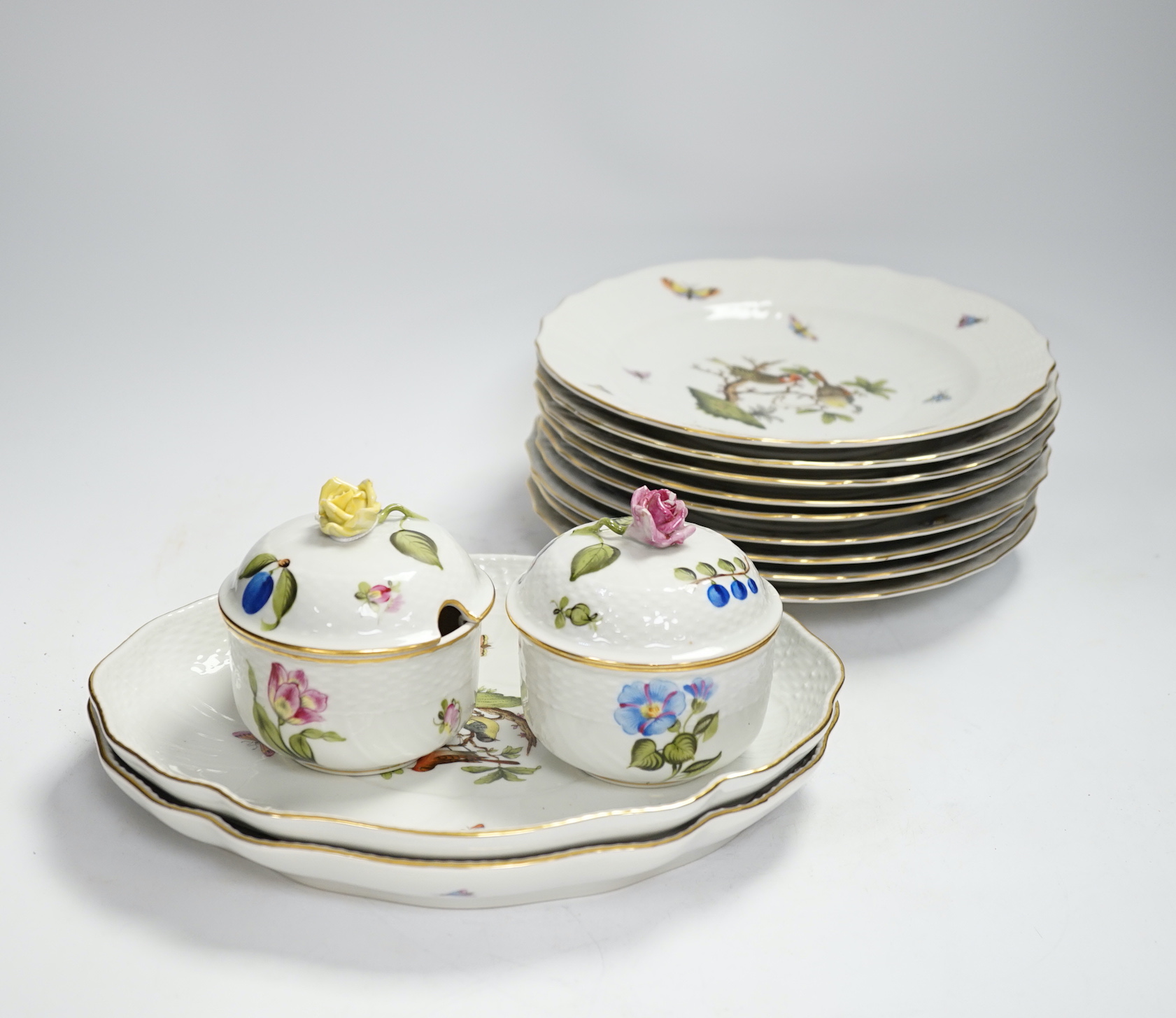 A Herend part dessert service comprising nine plates and two oval dishes together with two bowls, largest 26cm wide